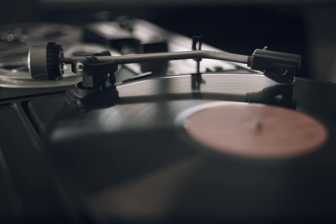 A turntable needle on a spinning record